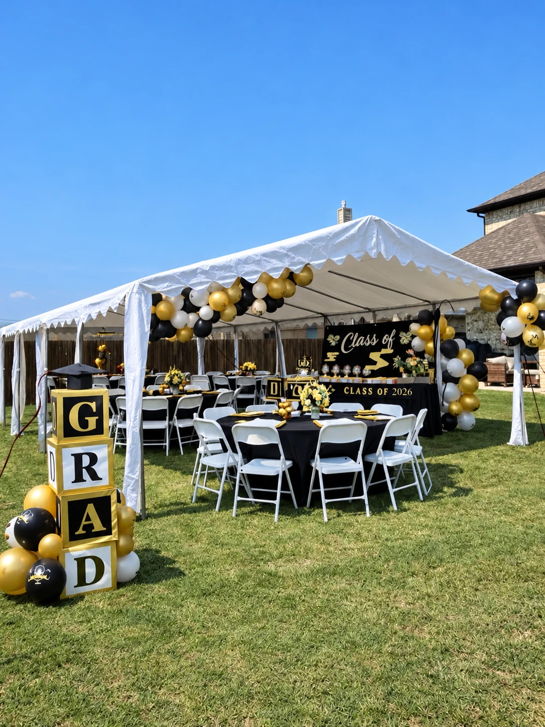 A real graduation party setup with tables, balloons and graduation decorations